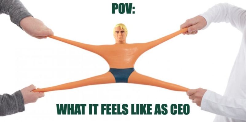 Meme of a Stretch Armstrong toy pulled in four directions by four hands, captioned POV: what it feels like as CEO