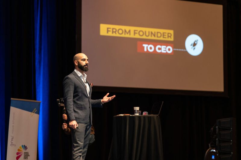 Ayman Al-Abdullah presenting in front of a From Founder to CEO slide